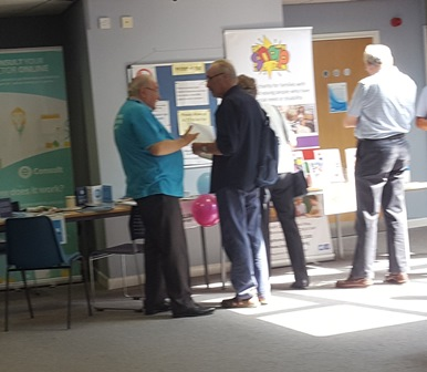 Patients at the Carer's Event speaking with representatives